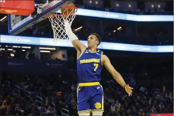  ?? SHAE HAMMOND — BAY AREA NEWS GROUP, FILE ?? The Warriors’ Patrick Baldwin Jr. (7) dunks the ball against the Jazz at Chase Center in San Francisco on Dec. 28.