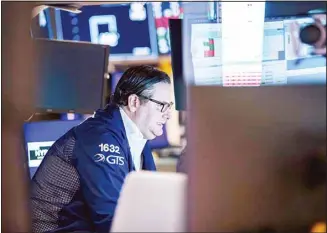  ?? ?? In this photo provided by the New York Stock Exchange, specialist Gregg Maloney works at his post on the floor, on May 16, 2022. Stocks fell in morning trading on Wall Street Monday, continuing a losing streak that has brought the market down for six weeks in a row. (AP)