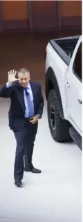  ??  ?? Ford vice-president Joe Hinrichs unveils pickup truck. It has four full-size doors a