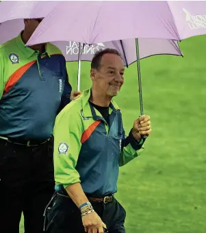  ?? Nigel Roddis ?? Jeremy Lloyds in his umpiring days carrying out a pitch inspection