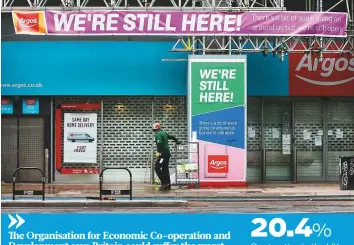  ?? Bloomberg ?? ■ A shuttered Argos catalogue shop, operated by J Sainsbury Plc, in London. The UK economy shrank the most on record in April as businesses and workers reeled under the lockdown.