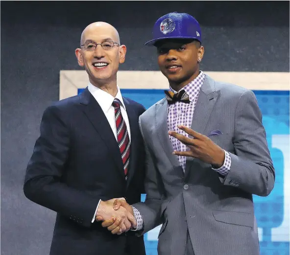  ?? — GETTY IMAGES ?? Markelle Fultz shakes hands with NBA commission­er Adam Silver after being drafted first overall by the Philadelph­ia 76ers at the NBA draft in New York Thursday. The day had no shortage of drama, chief being Jimmy Butler leaving the Chicago Bulls for...