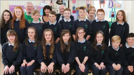  ?? Photo by Sheila Fitzgerald. ?? 6th Class pupils at St. Brendan’s National School, Rathcoole, pictured at their Graduation Ceremony with School Principal Susan O’ Connor, Deputy Principal Mary Lynch, Fr. Tom Leane PP, and Donal McCarthy, Chairman of Board of Management.