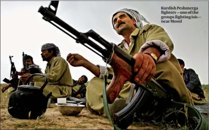  ?? PHOTO: AP ?? Kurdish Peshmerga fighters — one of the groups fighting Isis — near Mosul