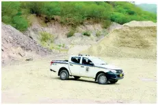  ??  ?? Police patrol a quarry in Bull Bay on Wednesday in a bid to drive away criminals who have targeted the worksite.