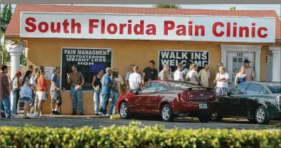  ?? © SUN-SENTINEL/ZUMA WIRE ?? Customers line up in 2008 at South Florida Pain Clinic in Wilton Manors. It was one of the first clinics opened by ChrisGeorg­e, of Wellington, who with his twin brother, Jeff, would grow his enterprise into one of the largest pill mills in the country from clinics in Palm Beach and Broward counties.POST EXCLUSIVE: HOW FLORIDA IGNITED THE HEROIN EPIDEMIC PART 2