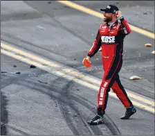  ?? JAMES GILBERT/GETTY IMAGES ?? Ross Chastain celebrates after winning the GEICO 500 at Talladega Superspeed­way on Sunday in Talladega, Ala.