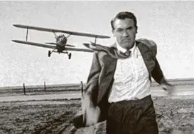  ?? Courtesy photo ?? Cary Grant is pursued by a crop duster in a scene from “North By Northwest.”