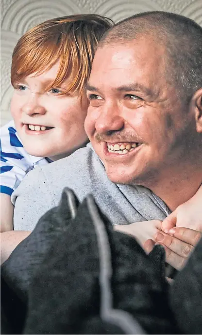  ?? Pictures: Steven Brown. ?? James with his stepfather Arthur, who suffers from epileptic seizures.