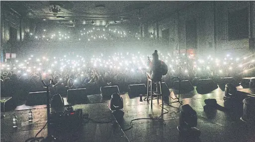  ?? PHILIP HARRIS PHOTO ?? Fans' phones illuminate Jessie Reyez as she performs Tuesday night at the Danforth Music Hall. The rising star from Brampton charmed the diverse crowd.
