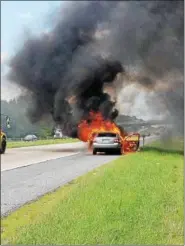  ?? PHOTO COURTESY OF KEN SHULER, LIMERICK FIRE CHIEF ?? Limerick Fire Company responded to Route 422 westbound on Wednesday for a report of a fully involved car fire. Crews were able to douse the fire in a few minutes and open the left lane to passing traffic.