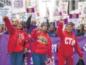  ?? Ashlee Rezin Garcia / Associated Press ?? Members of the Chicago Teachers Union rally. The union’s 25,000 members plan a strike today, and the district has canceled classes.