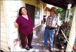  ?? GARY CORONADO/LOS ANGELES TIMES ?? Jovita Torres, left, with her friend and neighbo, Rodolfo Romero, in the impoverish­ed farmworker­s enclave of the Tombstone Territory in Sanger. Torres had to replace a 60-foot-deep well with a 200-foot one to access water.
