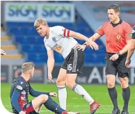  ??  ?? Ref Steven Mclean steps in as County’s Billy Mckay and Ayr’s Jamie Adams exchange words