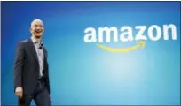 ?? FILE PHOTO - ASSOCIATED PRESS ?? Amazon CEO Jeff Bezos walks on stage June 16, 2014, for the launch of the new Amazon Fire Phone, in Seattle. Amazon is looking for a place to put a second headquarte­rs operation.