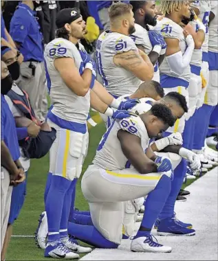  ?? Wally Skalij Los Angeles Times ?? BEFORE THE RAMS’ inaugural game at SoFi Stadium in Inglewood against the Dallas Cowboys, several players on both teams kneeled in protest during the national anthem.