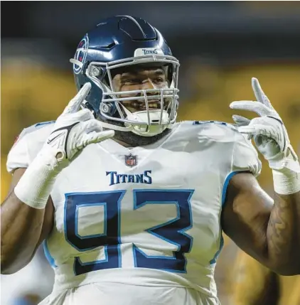 ?? MATT DURISKO/AP ?? Titans defensive tackle Teair Tart gestures during warmups before a game Nov. 2 in Pittsburgh. The Dolphins signed Tart to a one-year deal to further bolster their defense.