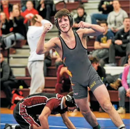  ?? NATE HECKENBERG­ER — FOR DIGITAL FIRST MEDIA ?? West Chester East’s Corey Celenza celebrates after defeating Lower Merion’s Christian Hodges, 5-3, for fifth-place at 120 pounds.