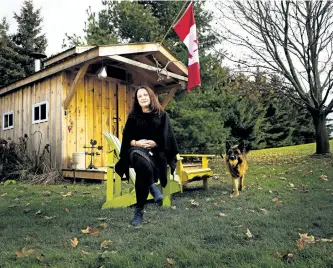  ?? NATHAN DENETTE/THE CANADIAN PRESS ?? Bryna Rabishaw poses for a photograph in front of her late husband Kevin Rabishaw’s sugar shack, which he made homemade maple syrup in at their home in Sharon, Ont., on Tuesday. Despite having surgery to remove a large tumour on his pancreas, followed...