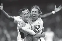  ?? REUTERS ?? Luka Modric (right) celebrates scoring Real Madrid’s goal with Lucas Vazquez during Sunday’s La Liga match at Santiago Bernabeu Madrid on Sunday.