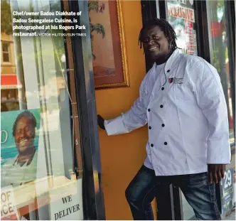  ?? VICTOR HILITSKI/SUN-TIMES ?? Chef/owner Badou Diakhate of Badou Senegalese Cuisine, is photograph­ed at his Rogers Park restaurant.