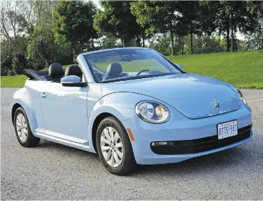  ?? Graeme Fletcher / Driving ?? The 2014 Volkswagen Beetle convertibl­e looks smart with the top up or down,
but it performs better on the road than its cute exterior might suggest.