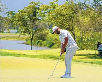  ?? EDUARDO VERDUGO/ASSOCIATED PRESS ?? Jon Rahm, of Spain, putts on the sixth hole during the third round of the Mexico Open at Vidanta in Puerto Vallarta, Mexico, on Saturday. Rahm built a two-shot lead over Kurt Kitayama and Cameron Champ.