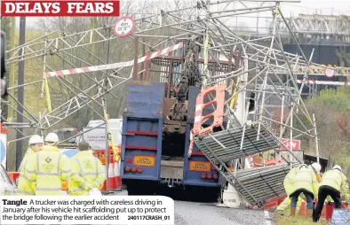  ?? 240117CRAS­H_01 ?? Tangle A trucker was charged with careless driving in January after his vehicle hit scaffoldin­g put up to protect the bridge following the earlier accident
