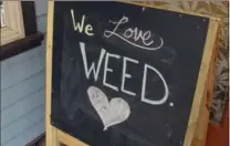  ?? BECKY BOHRER, THE ASSOCIATED PRESS ?? A sign stands outside Rainforest Farms, a retail marijuana shop in downtown Juneau, Alaska