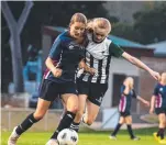 ??  ?? Mary MacKillop’s Charli Botham (left) and St Ursula’s Lucy Dyson battle for possession.