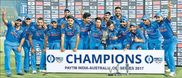  ??  ?? The victorious Indian team after the sevenwicke­t win over Australia in Nagpur on Sunday. The result helped them clinch the oneday series 41.