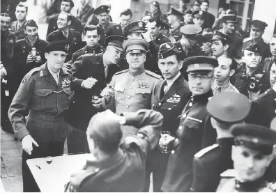  ?? STF / AFP / GETTY IMAGES ?? British Field Marshal Bernard Montgomery, from left, U.S. General Dwight D. Eisenhower, Soviet Marshal Georgy Zhukov and British Air Chief Marshal Arthur Tedder on May 7, 1945, toasting in Frankfurt after the signing of the German surrender in Reims.