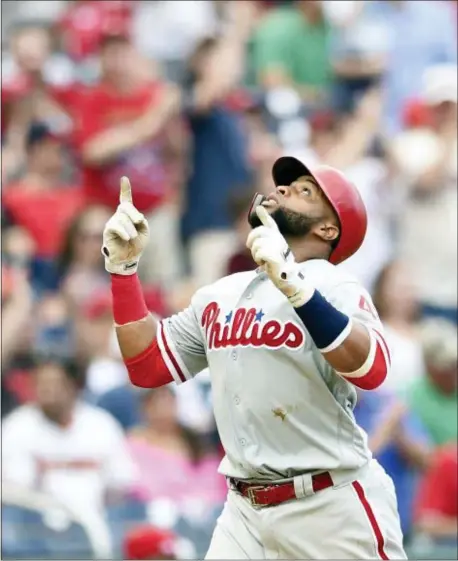  ?? NICK WASS — THE ASSOCIATED PRESS ?? Phillies’ Carlos Santana celebrates his home run during the eighth inning of a baseball game against the Washington Nationals, Saturday in Washington. The Phillies won 5-3.