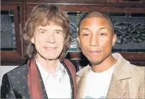  ?? Photograph­s by Billy Farrell BFA ?? MICK Jagger, left, and Pharrell Williams at the Chanel party.