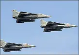  ?? AP ?? IAF’S Tejas jets during rehearsals ahead of Aero India 2021 at Yelahanka air base in Bengaluru on Tuesday.