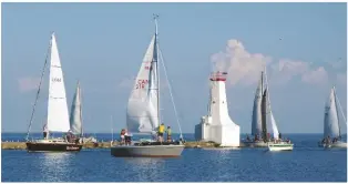  ??  ?? BELOW Cobourg Yacht Club preparing for an evening of racing