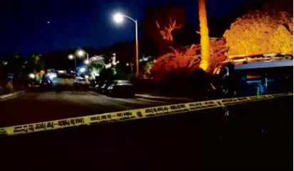  ?? AFP VIA GETTY IMAGES ?? In this screen grab from AFPTV video, police officers taped off the street leading to Matthew Perry’s house after the “Friends” actor was found dead on Oct. 28.