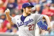  ?? BRYNN ANDERSON AP ?? Dodgers starting pitcher Trevor Bauer (27) will be eligible to play again at the start of the MLB season.