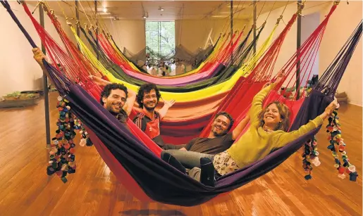  ?? PHOTO: LINDA ROBERTSON ?? Swinging . . . OPAVIVARA! members play in their hammocks at the Dunedin Public Art Gallery.