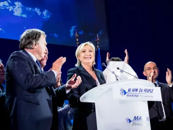  ??  ?? Marine Le Pen soaks up the applause from her supporters last night (Getty)