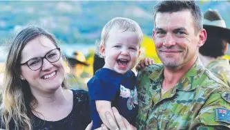  ?? HOME AT LAST: Corporal Ben O’Neill with wife Jayde and daughter Audrey, 1. Pictures: ZAK SIMMONDS ??