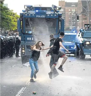  ?? Picture: Getty Images. ?? A water cannon is turned on protesters during the “Welcome to Hell” anti-G20 event in Hamburg.