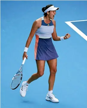  ??  ?? Spain’s Garbine Muguruza reacts to winning a point during her semifinal win over Simona Halep in Melbourne last night. GETTY IMAGES