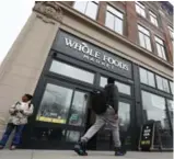  ?? JULIO CORTEZ/THE ASSOCIATED PRESS ?? Over the past two years, Whole Foods’ share price has fallen as the company faces increased competitio­n.