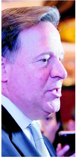  ?? AP ?? Panama President Juan Carlos Varela Rodríguez poses for photograph­ers before a conference on the Panama invest in Hong Kong, Tuesday, April 2, 2019.