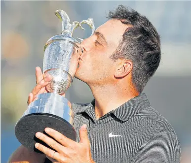  ??  ?? Francesco Molinari kisses the Claret Jug after winning the British Open at Carnoustie.