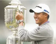  ?? Scott Strazzante / The Chronicle ?? Collin Morikawa poses with the Wanamaker Trophy after winning the PGA Championsh­ip at Harding Park on Sunday.