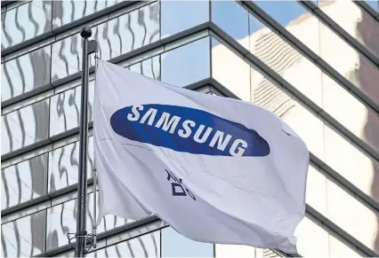  ?? BLOOMBERG ?? A Samsung Electronic­s flag flies outside the company’s Seocho office building in Seoul, South Korea.