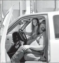  ??  ?? Brooke Duvall, 12, joins her father, Jeremy Duvall, in a truck outside the family’s poultry operation.