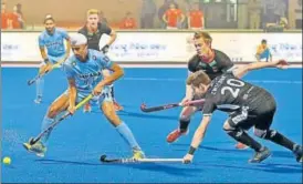  ?? PTI ?? ▪ India’s Mandeep Singh tries to get past German defenders during a HWL Final match on Monday.